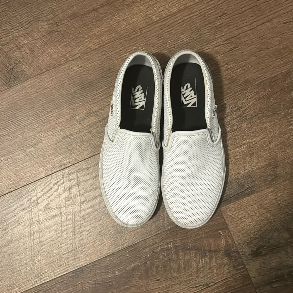 White leather Vans slip ons.